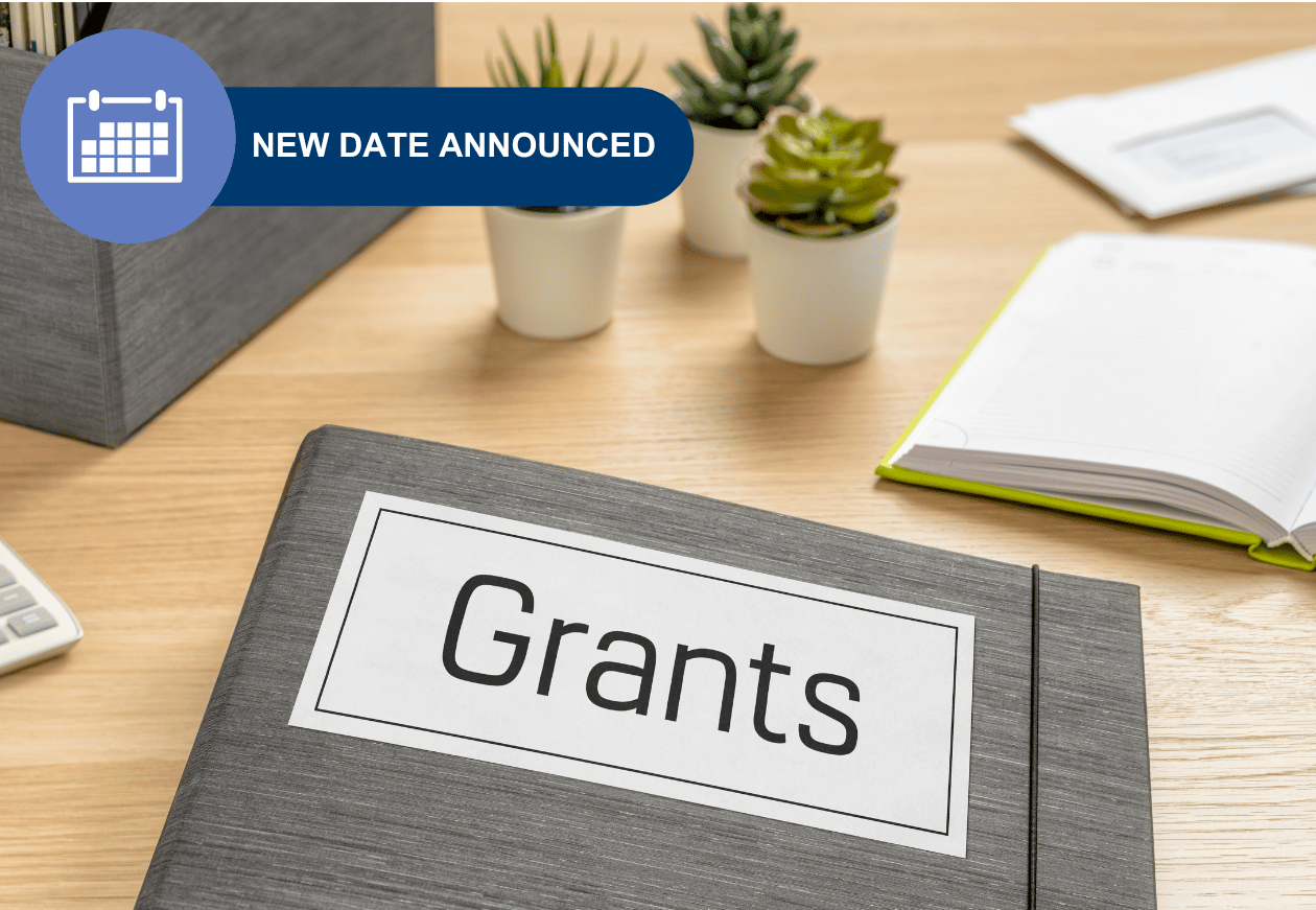 File on desk with words 'grants' in capital letters