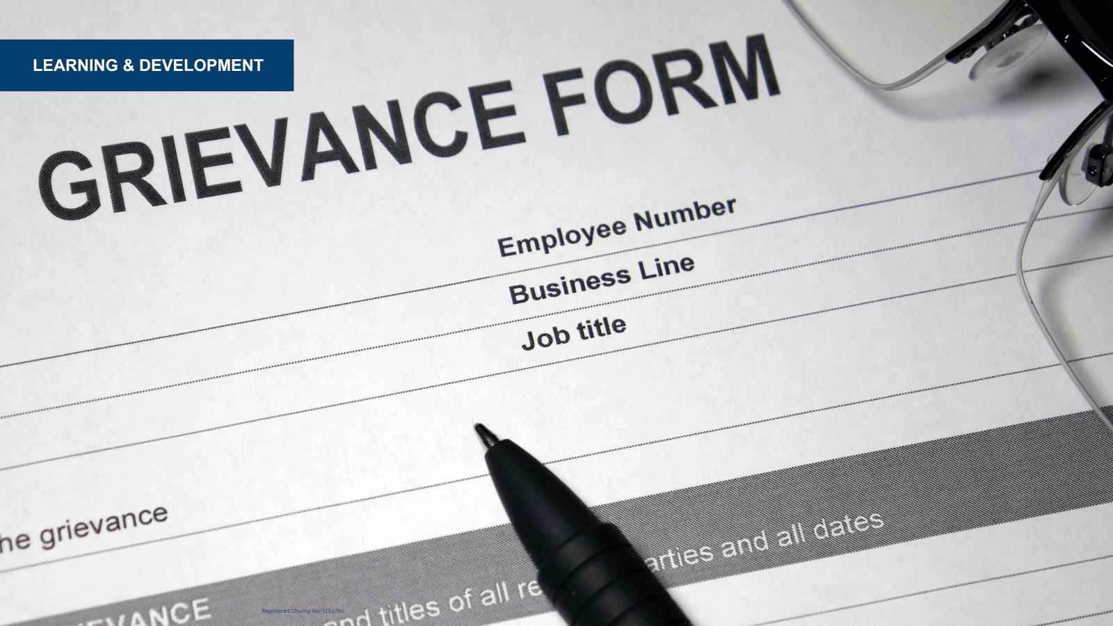 Form on desk with words 'Grievance Form'